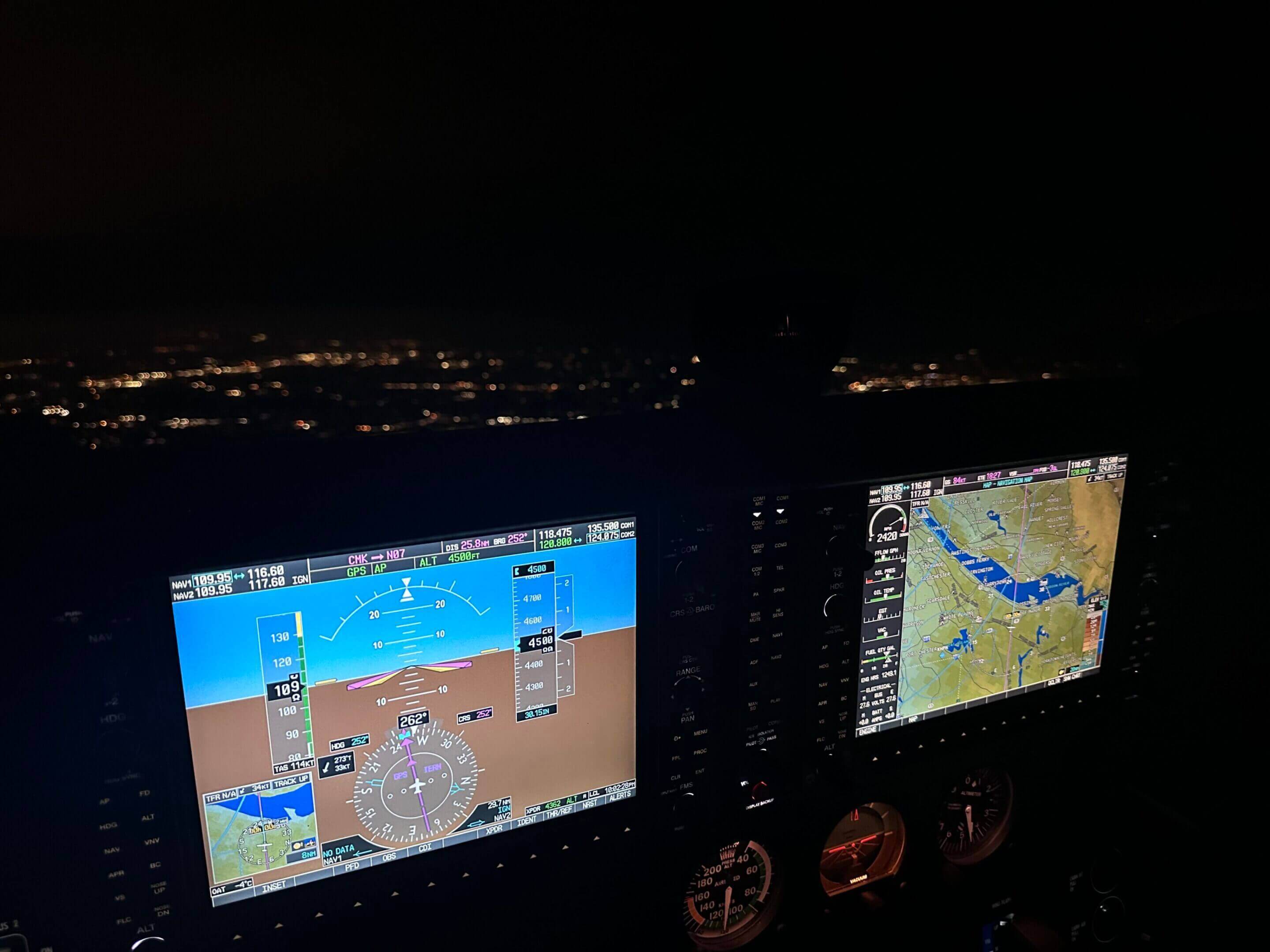 Two monitors are shown in a plane cockpit.