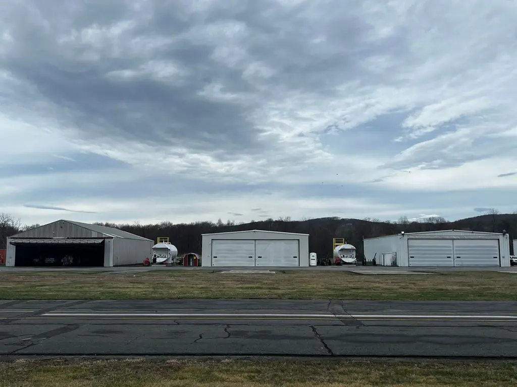 A group of trucks parked in front of a building.