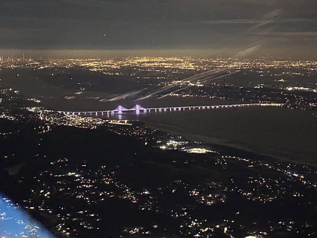 Aerial view of illuminated bridge at night.